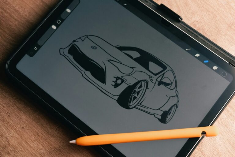 Black line drawing of a car on a tablet screen with a stylus resting beside it